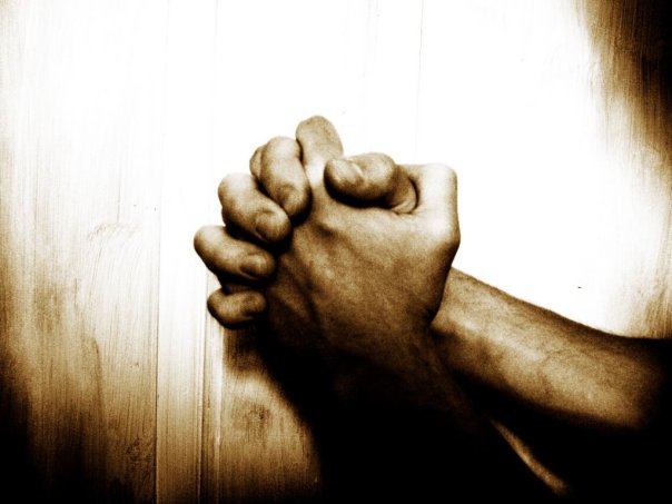hands crossed in prayer
