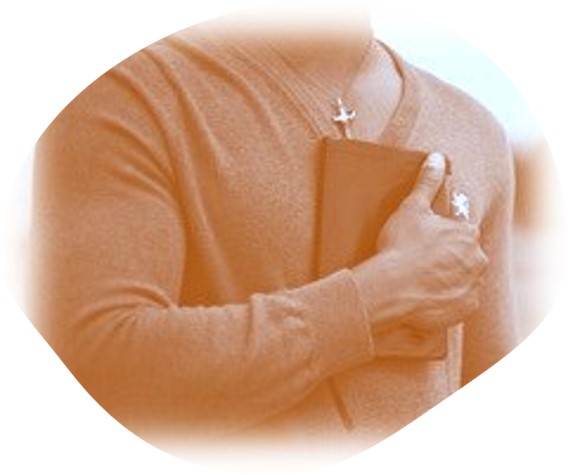 rustic color of man wearing cross and holding BIBLE